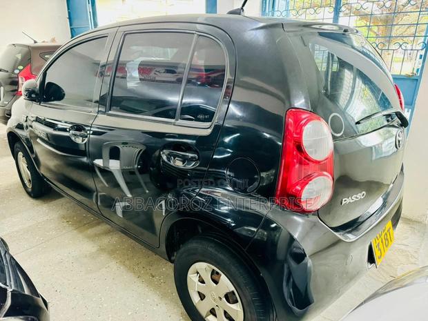 Sleek 2013 Black Toyota Passo - Compact Car with Excellent Fuel Efficiency