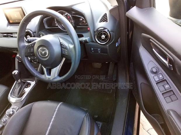 Mazda Demio 2016 Purple: Pre-owned Hatchback with Style and Comfort