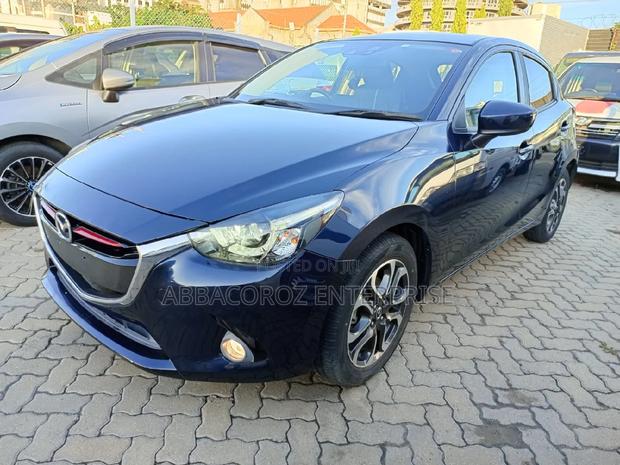 Mazda Demio 2016 Purple: Pre-owned Hatchback with Style and Comfort