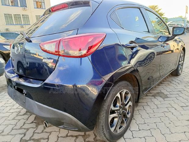 Mazda Demio 2016 Purple: Pre-owned Hatchback with Style and Comfort