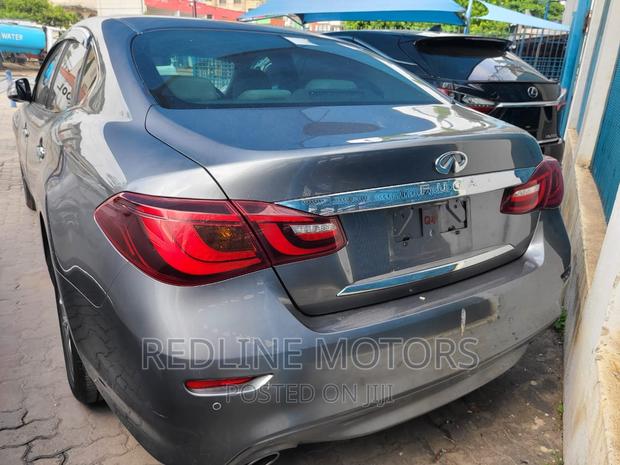 Gray Nissan Fuga 2016: Pre-owned Sedan with Style and Comfort