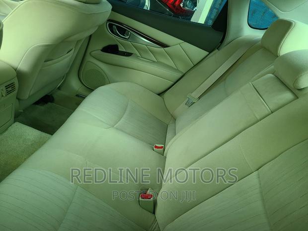 Gray Nissan Fuga 2016: Pre-owned Sedan with Style and Comfort
