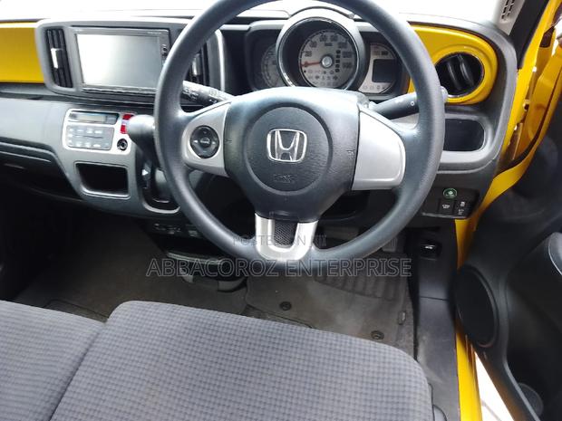 Yellow Honda N-One 2016: Stylish, Compact, and Budget-Friendly