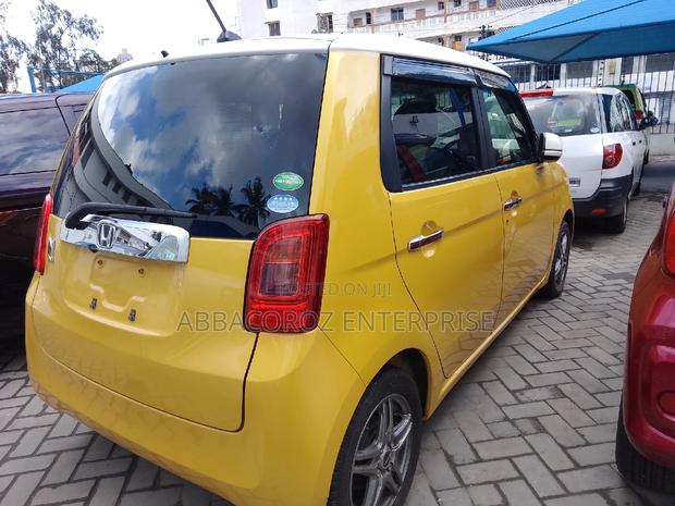Yellow Honda N-One 2016: Stylish, Compact, and Budget-Friendly