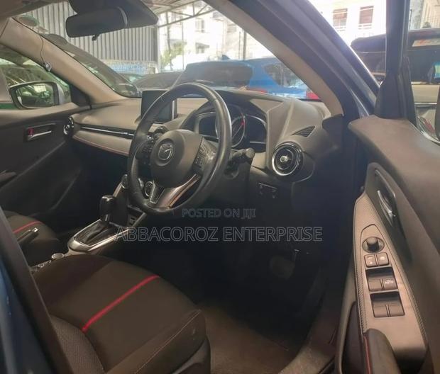 Teal Mazda Demio 2016: Compact Car with Style and Comfort