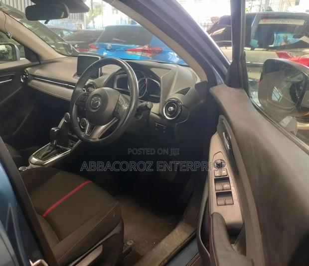 Teal Mazda Demio 2016: Compact Car with Style and Comfort