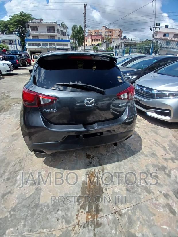 Gray Mazda Demio 2017 - Compact Car with High-Tech Features and Low Emissions