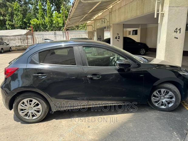 Gray Mazda Demio 2017 - Compact Car with High-Tech Features and Low Emissions