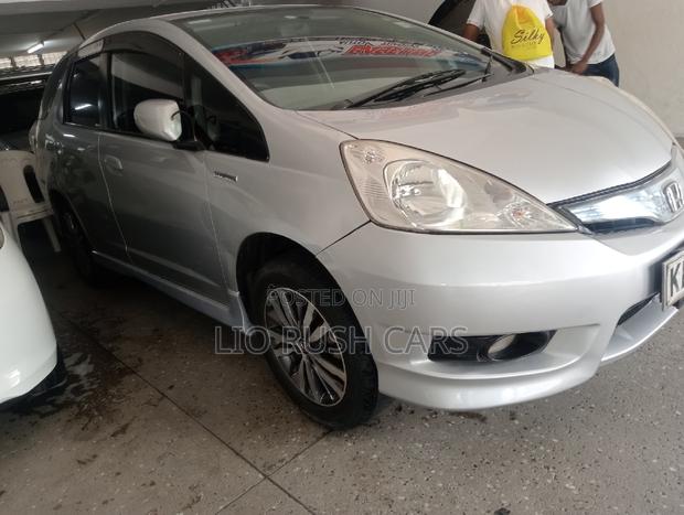 Silver 2014 Honda Fit Shuttle - Spacious, Efficient & Stylish, Ideal for Your Needs