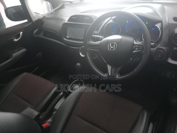 Silver 2014 Honda Fit Shuttle - Spacious, Efficient & Stylish, Ideal for Your Needs