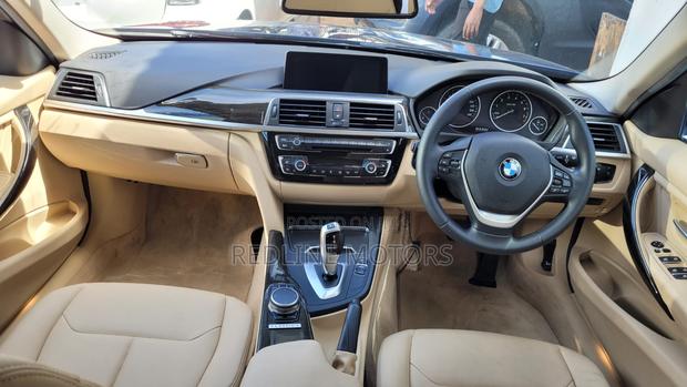 Pre-owned 2017 BMW 318i Sports Wagon in Blue