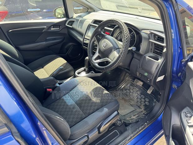 Pre-owned Blue 2014 Honda Fit - Compact & Versatile Sedan