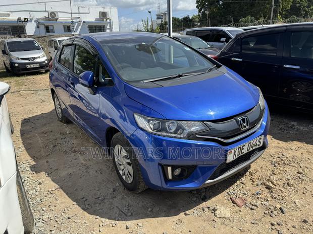 Pre-owned Blue 2014 Honda Fit - Compact & Versatile Sedan