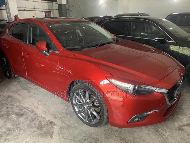 2017 Mazda Axela Red Hatchback Advertisement