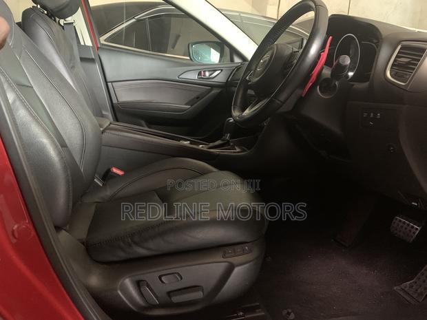 2017 Mazda Axela Red Hatchback Advertisement