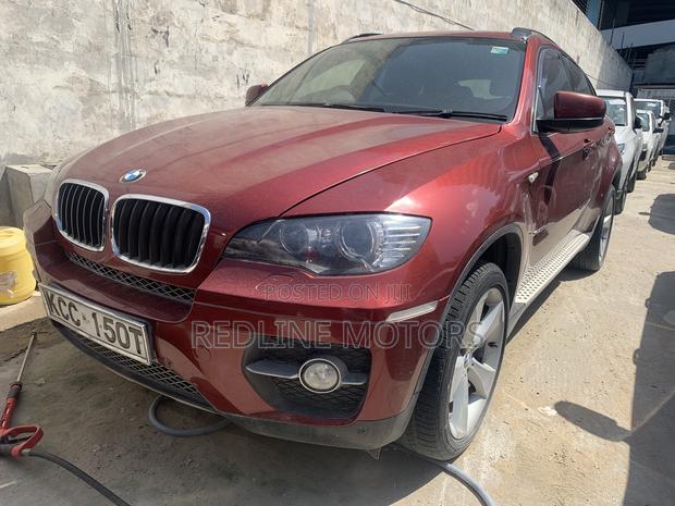 BMW X6 2008 Red Sports Activity Coupe - High-Performance and Sophisticated