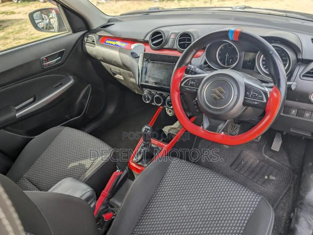 Black Suzuki Swift 2018: Efficient and Affordable Compact Sedan