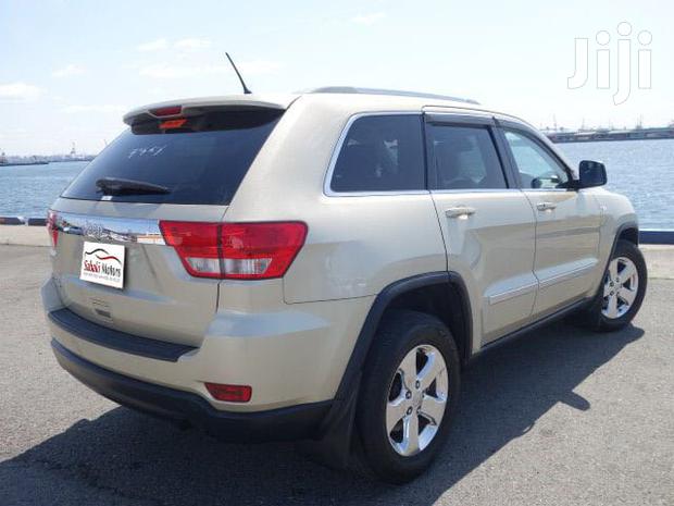 Pre-owned 2012 Jeep Grand Cherokee in Gold: Great Value!