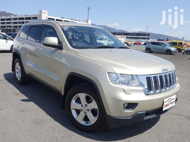 Pre-owned 2012 Jeep Grand Cherokee in Gold: Great Value!