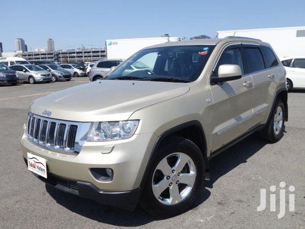 Pre-owned 2012 Jeep Grand Cherokee in Gold: Great Value!