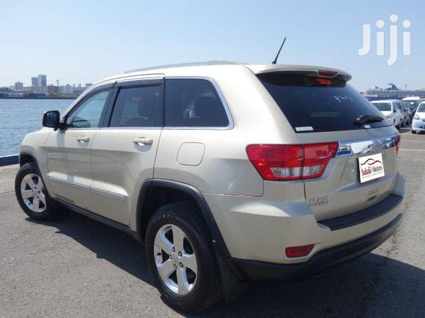 Pre-owned 2012 Jeep Grand Cherokee in Gold: Great Value!