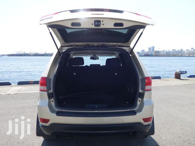 Pre-owned 2012 Jeep Grand Cherokee in Gold: Great Value!