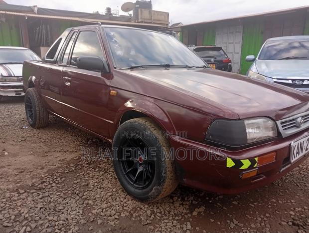 Mazda 323 1996 Maroon