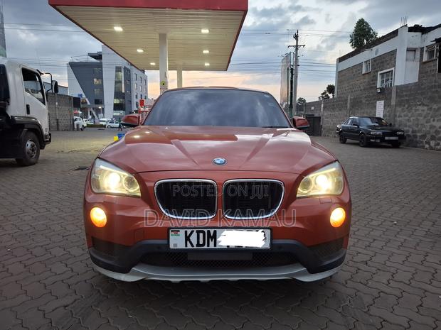 BMW X1 sDrive28i 4dr SUV (2.0L 4cyl Turbo 8A) 2015 Orange